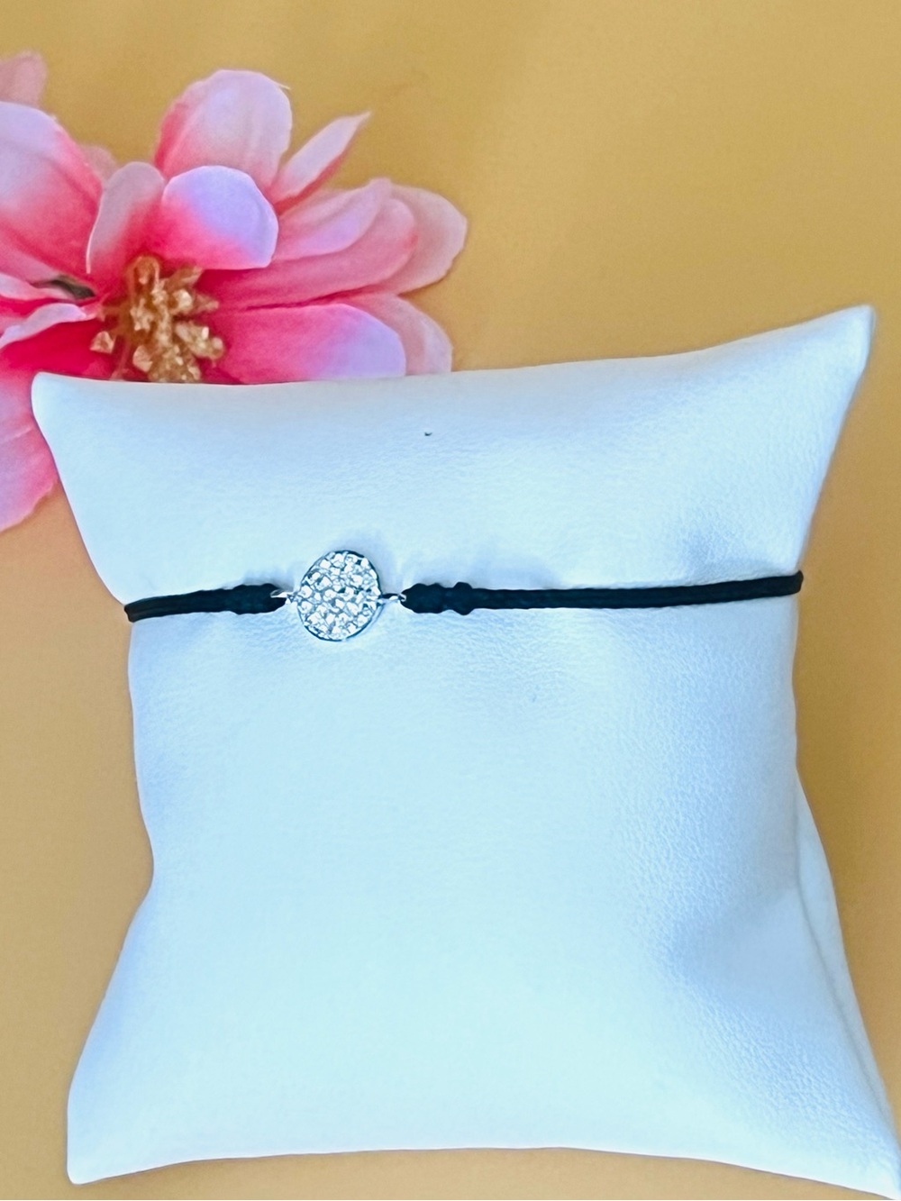 Paved round silver charm black string bracelet